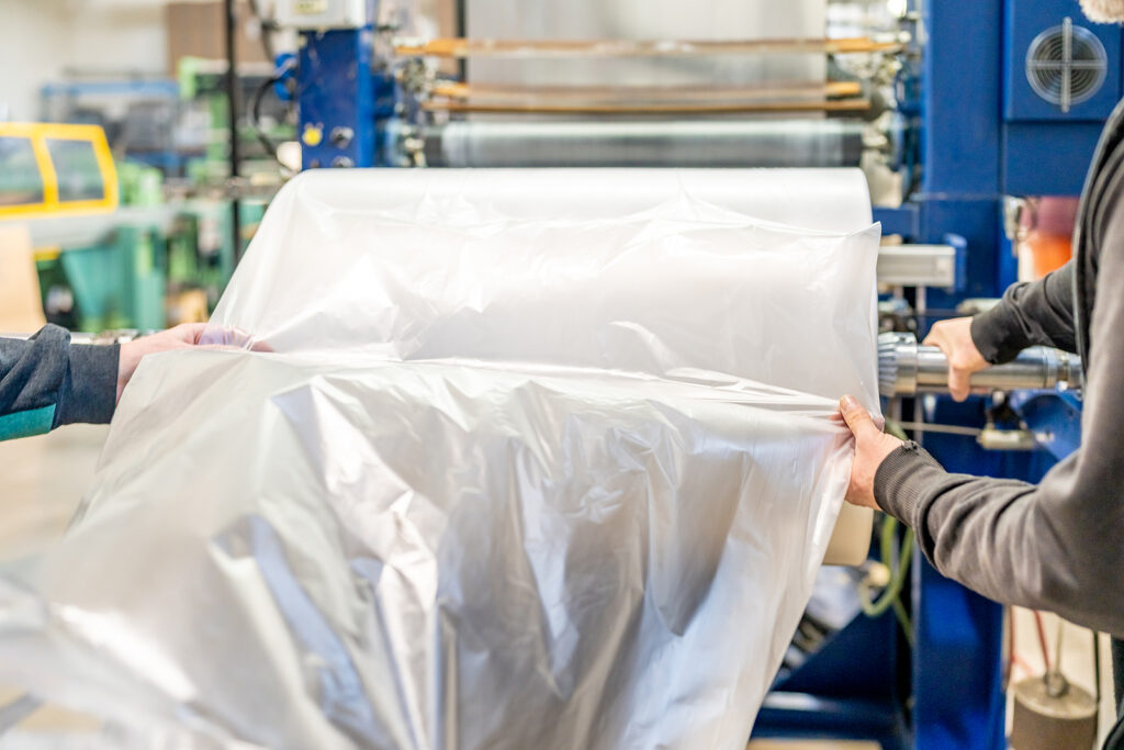 Large Plastic Roll In The Factory For The Production Of Plastic